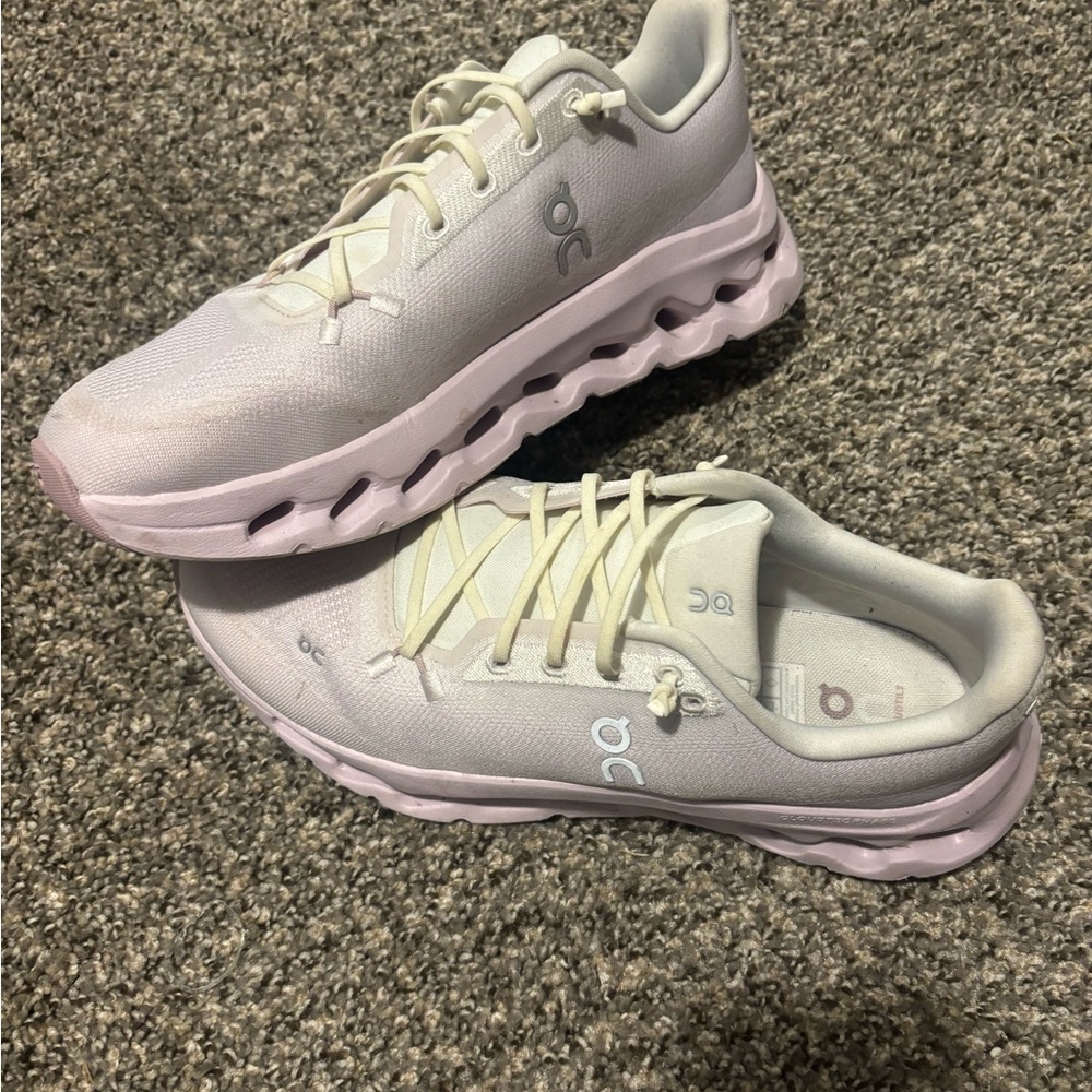 On cloud Women's Athletic Shoes in Cream and light lavender.